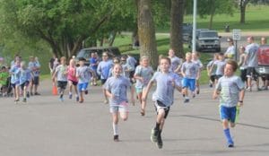 Kids ages 6-9 run in the Youth Fun Run.