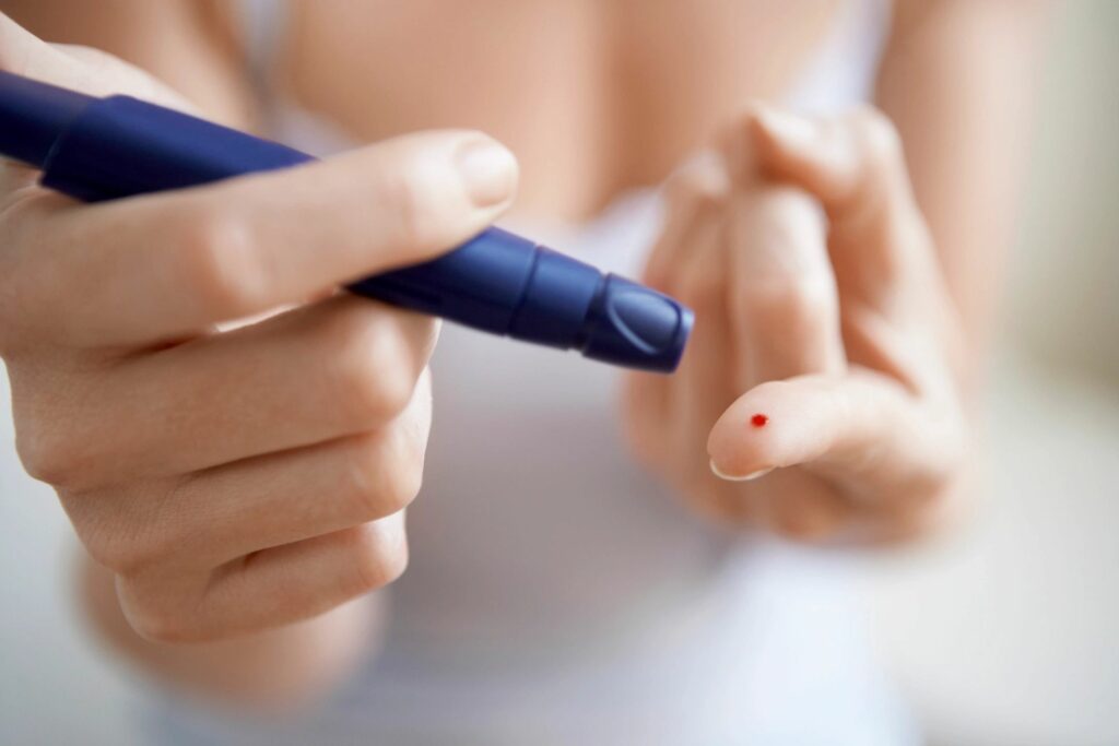 Diabetic Checking Blood Glucose