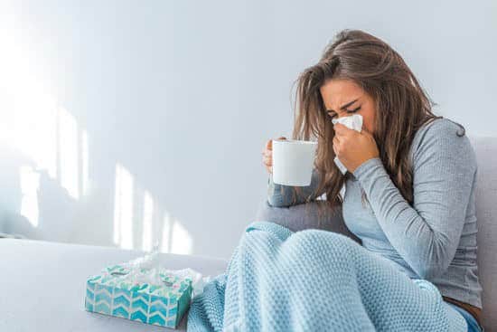 Preparing For Cold & Flu Season - Lady with cold