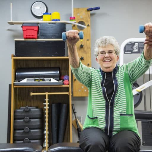 Stop Parkinson's Disease - Lady lifting weights